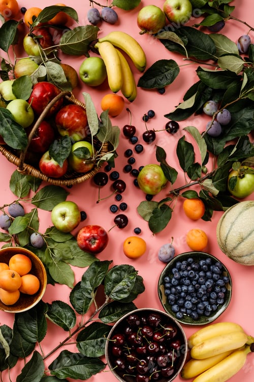 Preview: Flat-lay of fresh fruits and berries on pink background