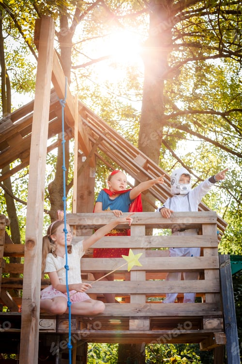 Preview: Three kids with superheroes costumes playing on their tree house