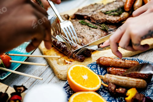 Preview: Closeup of homemade grilled food on wooden table summer party