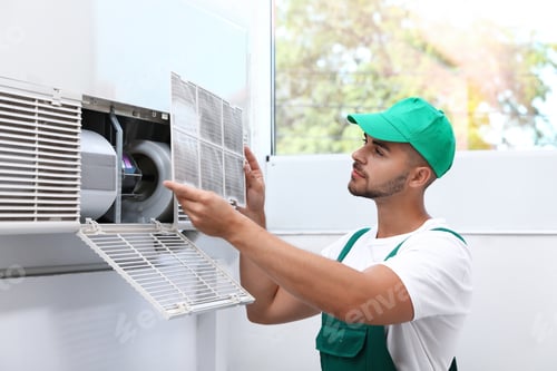 Preview: Professional technician maintaining modern air conditioner indoors