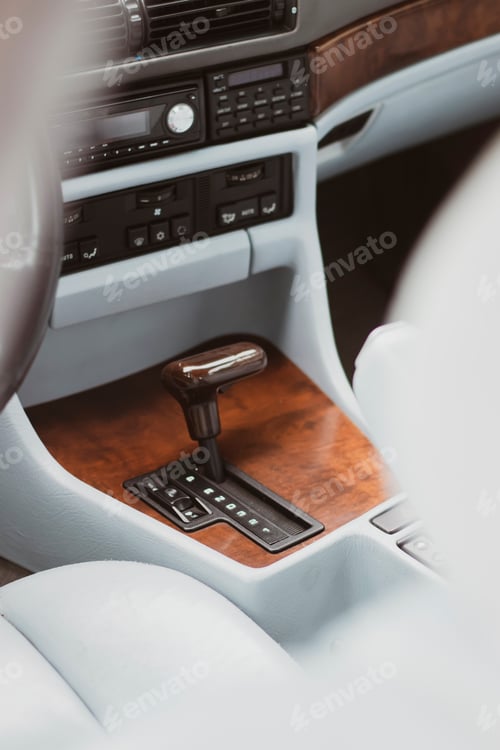 Preview: Vintage car with gray leather seats and wooden dashboard