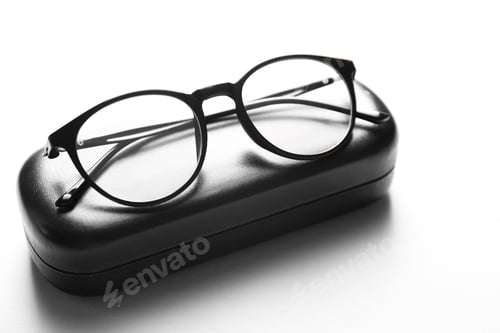 Preview: Case with stylish glasses on light background, closeup