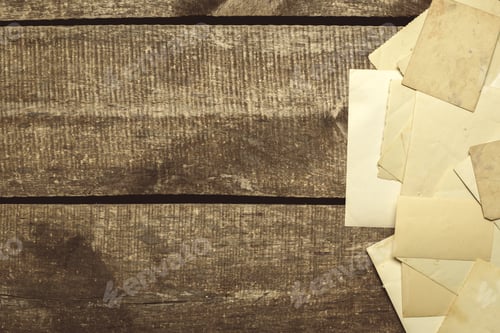 Preview: Collection of old letters and papers on a wooden table in indoor setting
