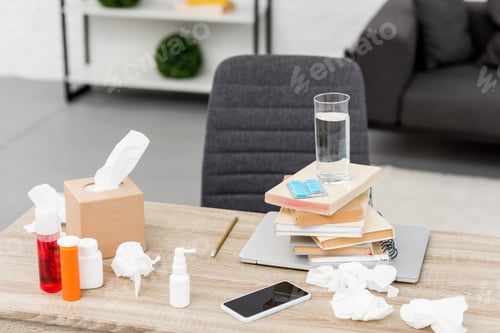 Preview: office workplace with laptop and various medicines
