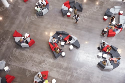 Preview: Students groups sitting in a modern university atrium