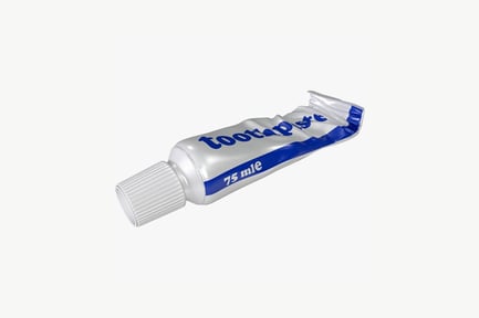 Preview: Empty toothpaste tube with blue cap and lettering
