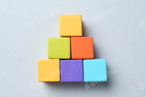 Preview: Family tree made with colorful cubes on light grey background, top view