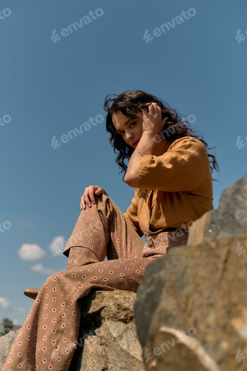 Preview: Young woman enjoying a sunny day outdoors in a fashionable summer outfit