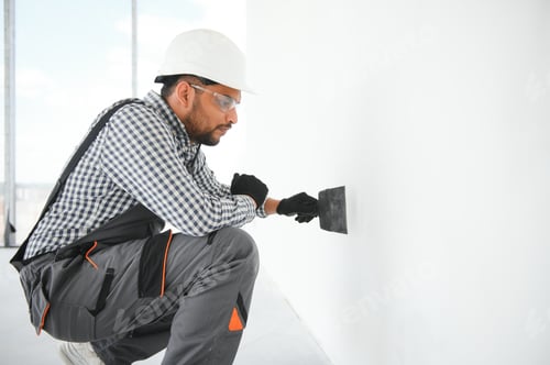 Preview: Indian worker makes repairs in an apartment