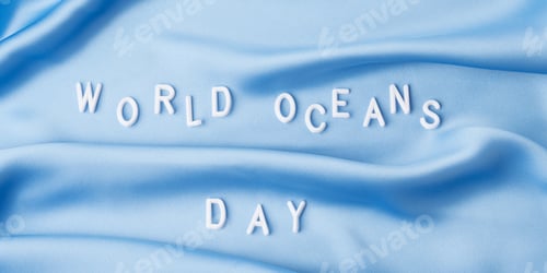 Preview: World oceans day in white letters on blue wave textile, june 8 holiday