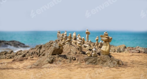Preview: Stacks of round stones on the beach