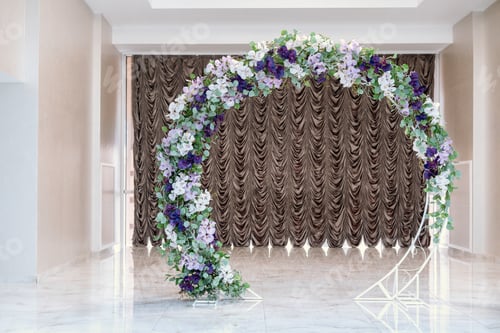Preview: Floral arch stands elegantly in a venue ready for a special event or ceremony