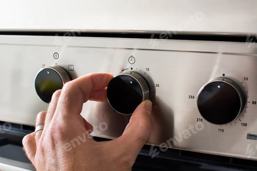 Preview: Man regulates the temperature of the oven