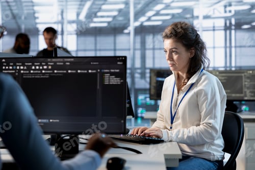 Preview: Programmer at work implementing cybersecurity measures to protect data center