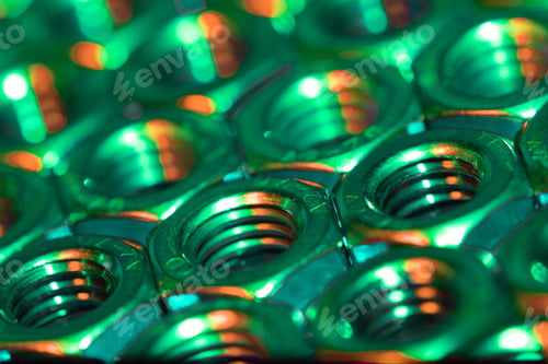 Preview: Closeup shot of screw nuts with the gr lights coming under it