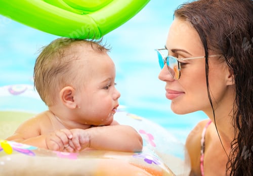Preview: Beautiful mother with son in the pool