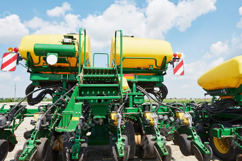 Preview: Close up of seeder attached to tractor in field. Agricultural machinery for spring works sowing