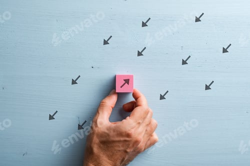 Preview: One arrow in a group of many pointing in an opposite direction