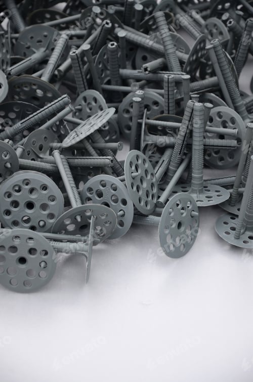 Preview: Background of many gray plastic dowels (fastening) for thermal insulation