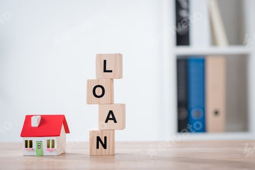 Preview: word loan made of wooden cubes and house model on wooden tabletop surface