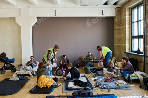 Preview: Two young volunteers spreading humanitarian help between refugees