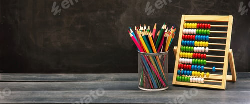 Preview: Back to school. Colorful pencils and Abacus on blue wooden desk, blackboard background