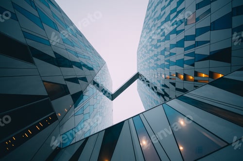 Preview: Low angle shot of a modern business building touching the sky