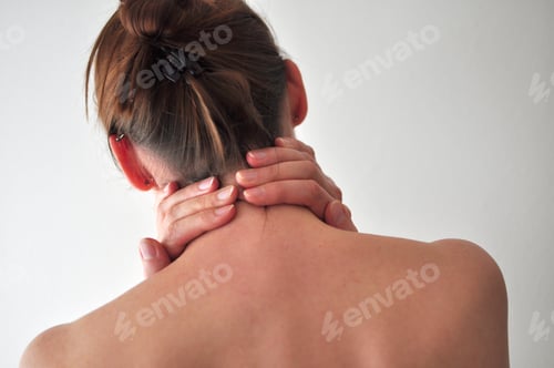 Preview: Woman holding her neck with both hands, backside