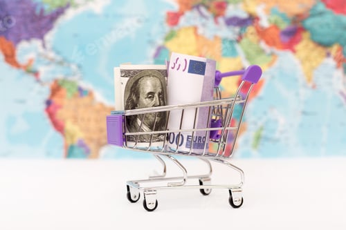 Preview: Shopping cart on world map background with dollar and euro banknotes. Concept for economic indicator