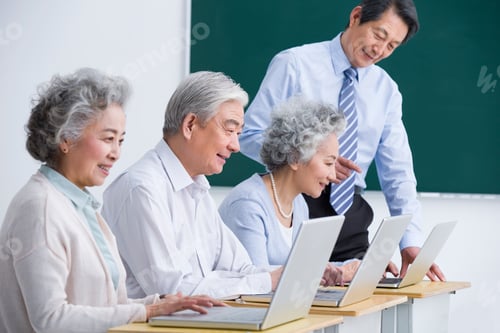 Preview: Senior Chinese adults having computer class at school