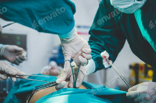 Preview: Medical team of surgeons in hospital doing invasive surgical interventions