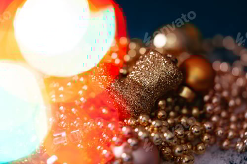 Preview: Christmas golden decorations with bokeh light close up .