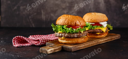 Preview: Close-up of home made tasty burger on wooden table.
