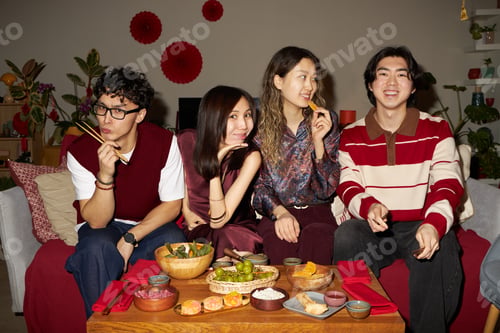 Preview: Group of Young Adult Asian Friends Celebrating Tet Holiday and Enjoying Food