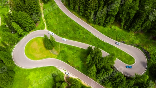 Preview: Cars driving on winding mountain road in the dolomites, italy