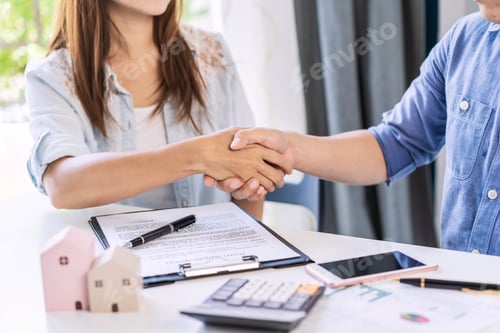 Preview: Business Handshake Sealing a Deal with Loan Application