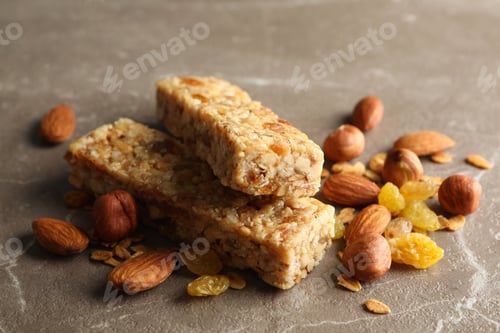 Preview: Tasty granola bars on gray background, close up