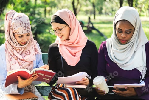 Preview: Friends reading book together at park