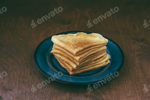 Preview: Sauce near stack of blini