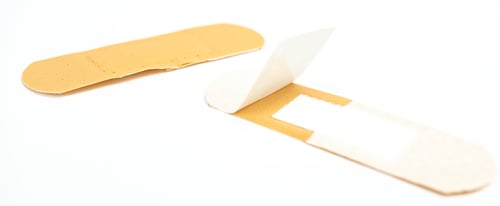 Preview: Closeup shot of a couple of bandaids isolated on a white surface