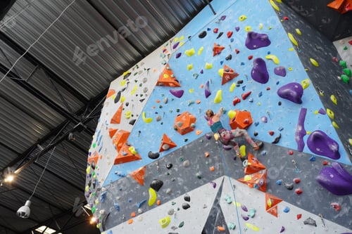 Preview: a large climbing wall is shown with colored boulder walls in the background