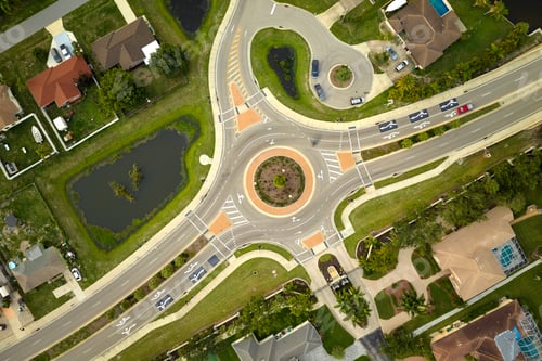 Preview: Aerial view of road roundabout intersection with moving cars traffic.