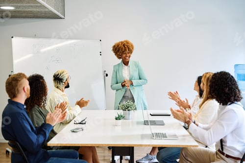 Preview: Colleagues applauding the presentation of a project of a coworker
