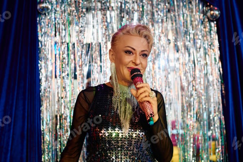 Preview: Bold drag queen captivates audience with holiday performance on vibrant stage