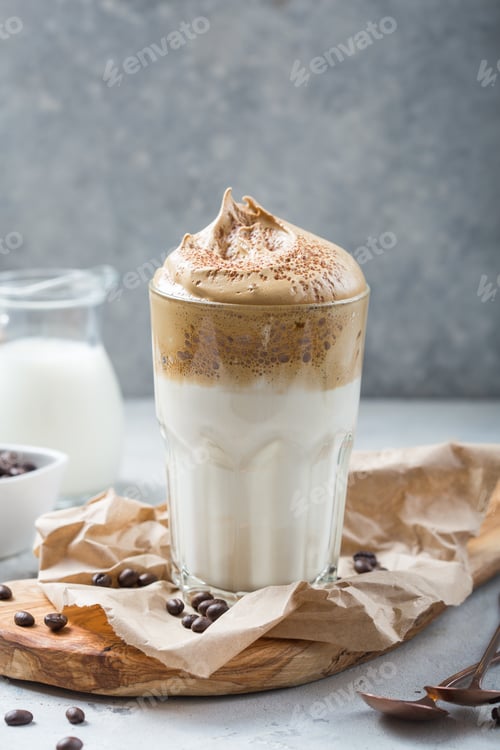 Preview: Dalgona creamy coffee in a glass on a light gray background with whipped foam. Korean food trend,