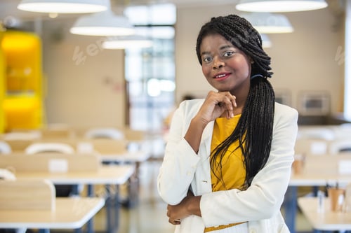 Preview: portrait happy smile African American woman standing in workplace.