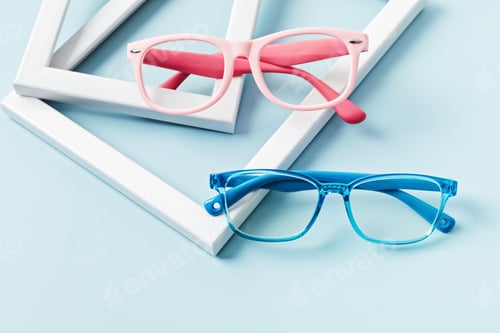 Preview: Child eyeglasses over pastel background. Optical store, glasses selection for kids