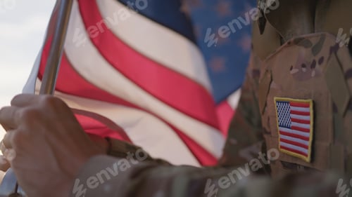 Preview: American Soldier Hoists The US Flag At The Base In The Morning