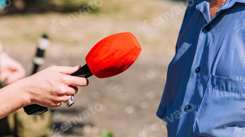 Preview: News reporters interviewing an important person outdoors