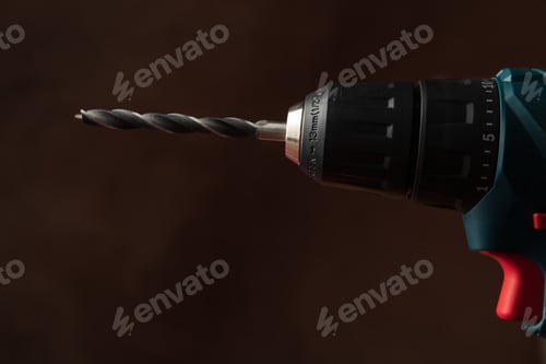 Preview: Cordless drill on brown background, space for text